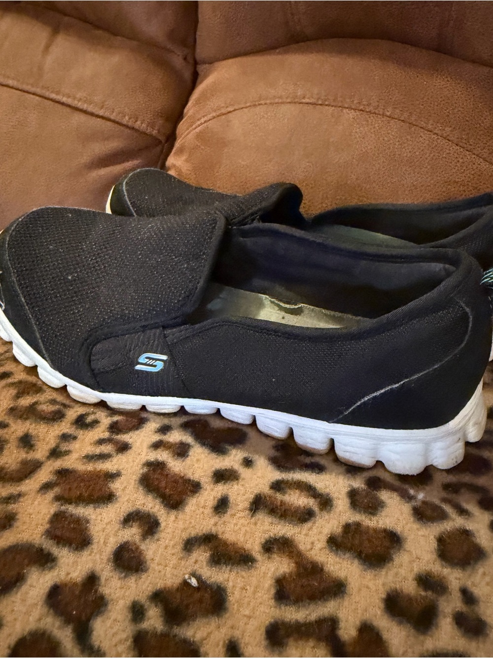 Skechers Women’s Black Slip-On Memory Foam Sneakers with White Sole